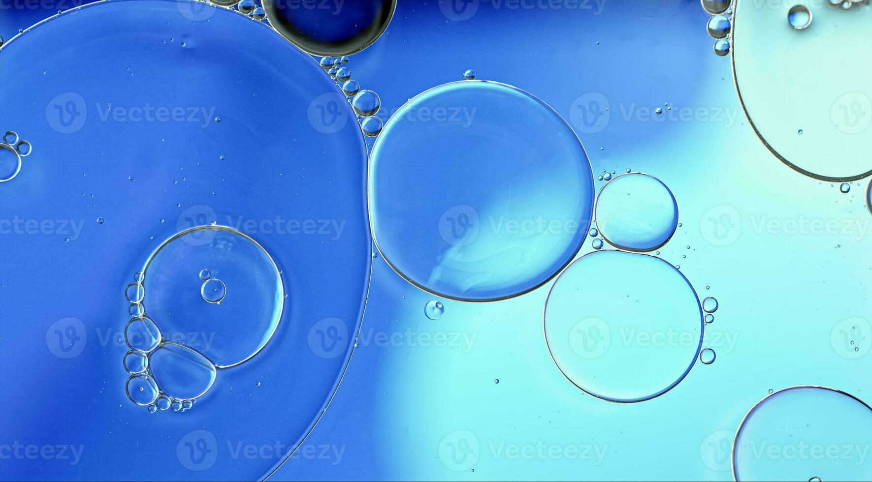 Abstract Colorful Food Oil Drops Bubbles and spheres Flowing on Water Surface photo