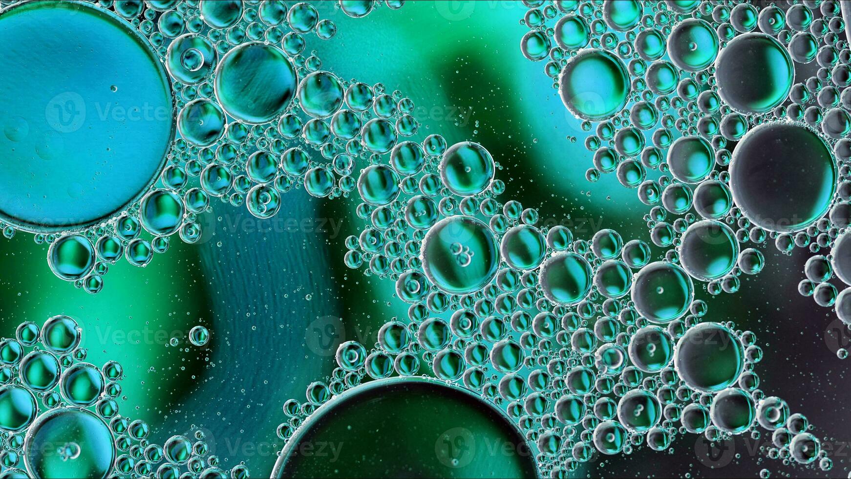 Abstract Colorful Food Oil Drops Bubbles and spheres Flowing on Water Surface photo