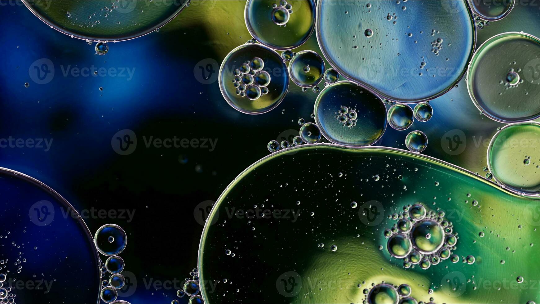 Abstract Colorful Food Oil Drops Bubbles and spheres Flowing on Water Surface photo