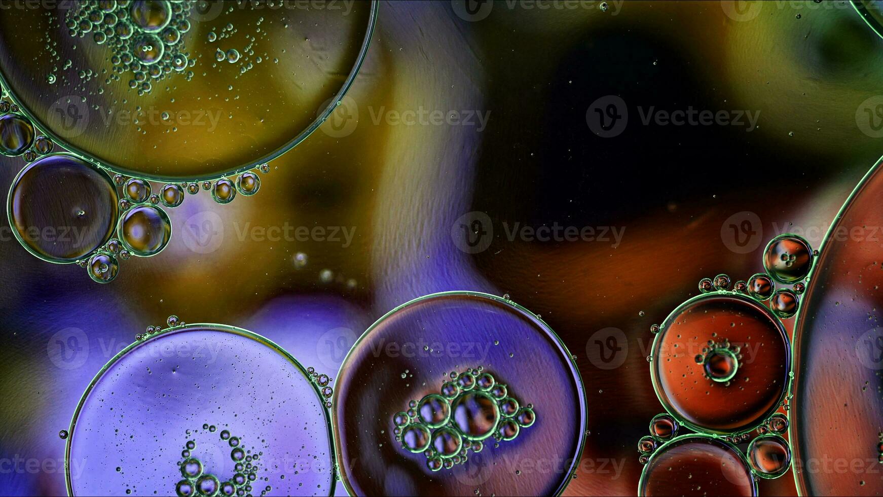 Abstract Colorful Food Oil Drops Bubbles and spheres Flowing on Water Surface photo