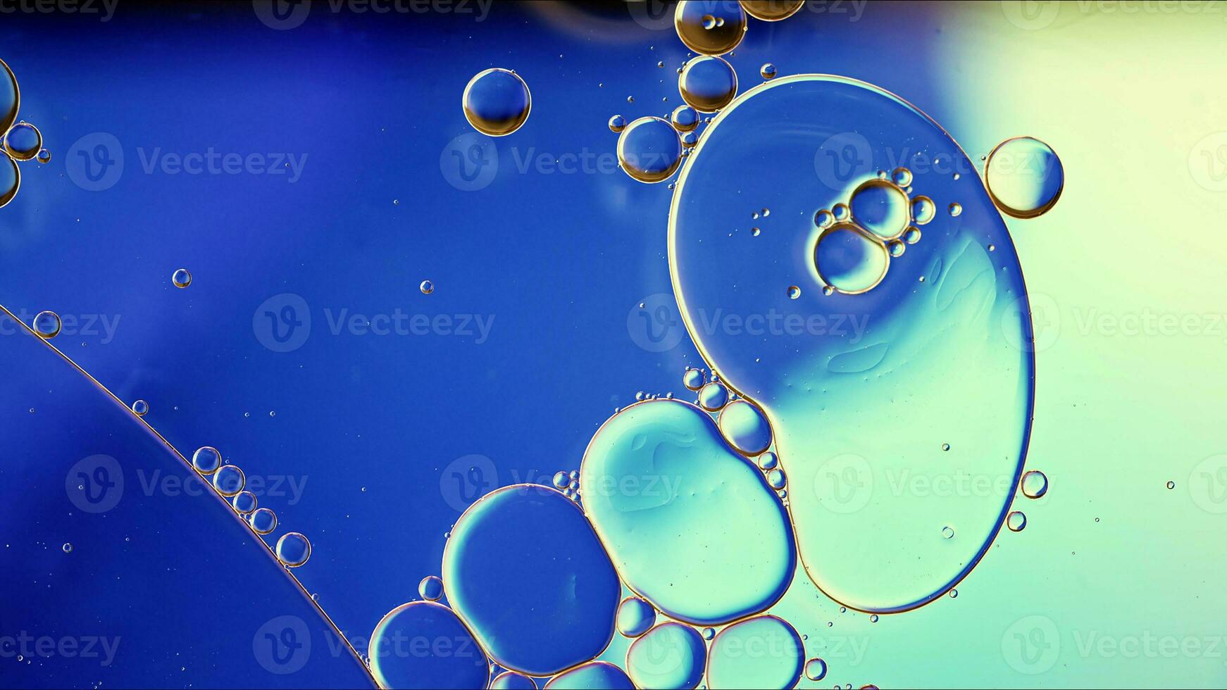 Abstract Colorful Food Oil Drops Bubbles and spheres Flowing on Water Surface photo