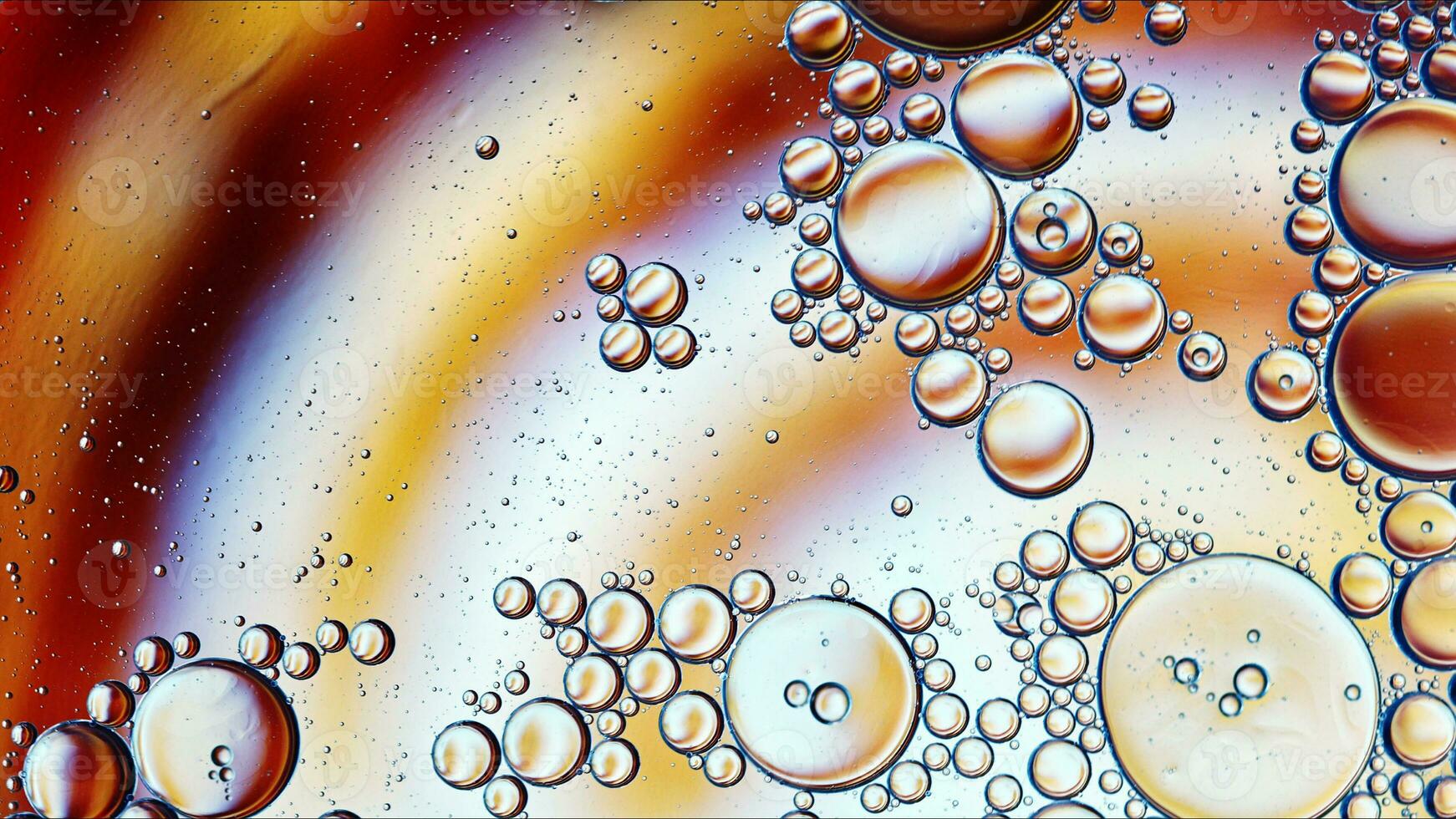 Abstract Colorful Food Oil Drops Bubbles and spheres Flowing on Water Surface photo