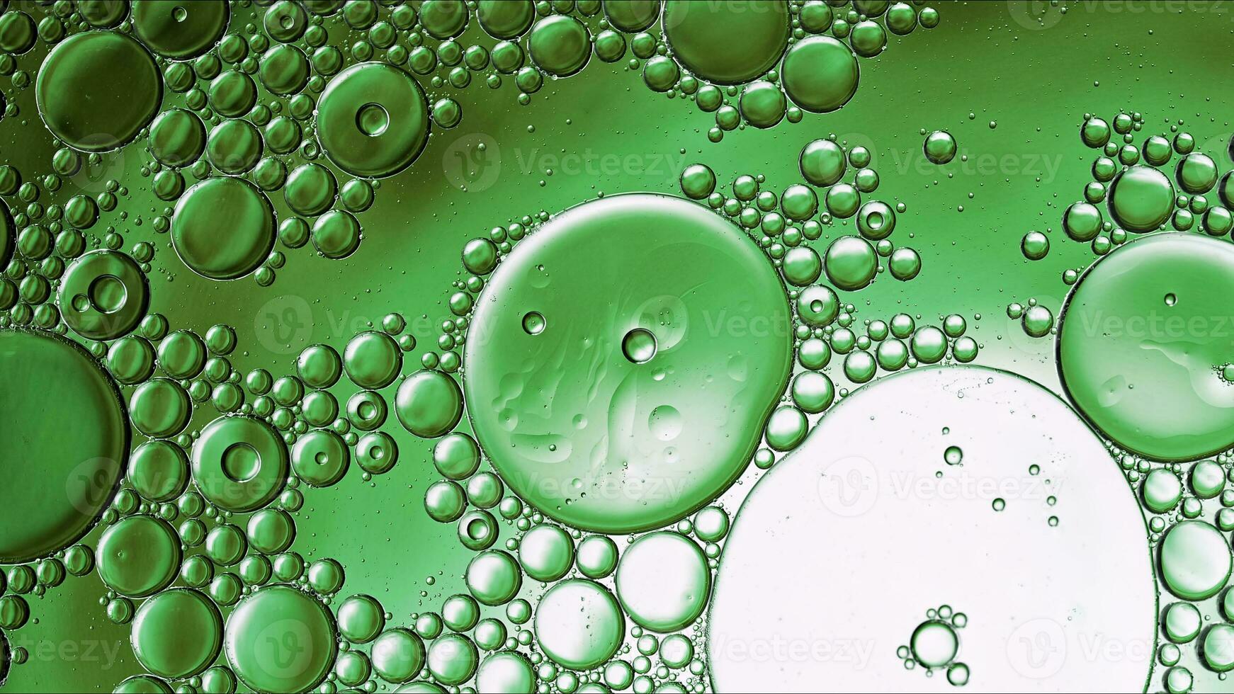 Abstract Colorful Food Oil Drops Bubbles and spheres Flowing on Water Surface photo