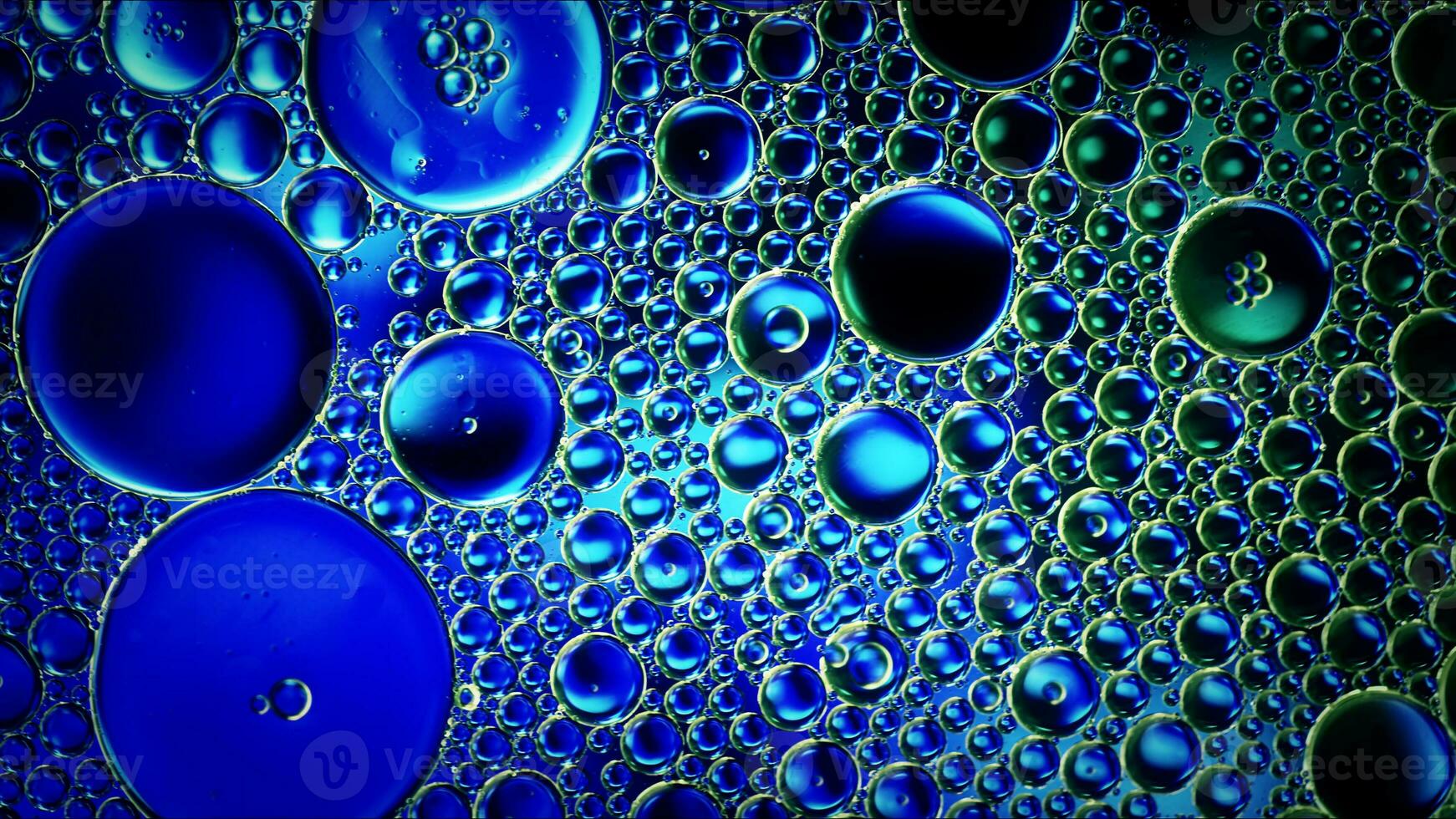 Abstract Colorful Food Oil Drops Bubbles and spheres Flowing on Water Surface photo