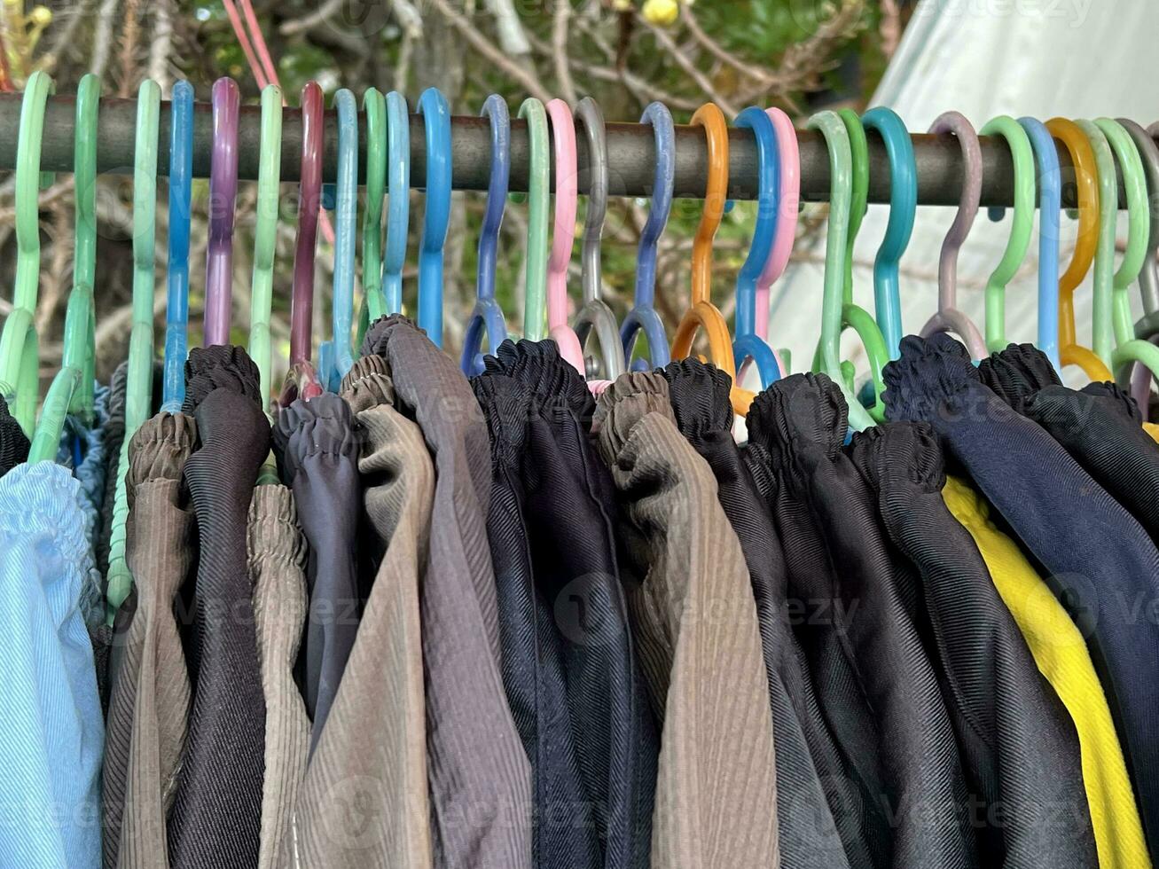 clothes hanging on a hanger in the garden photo