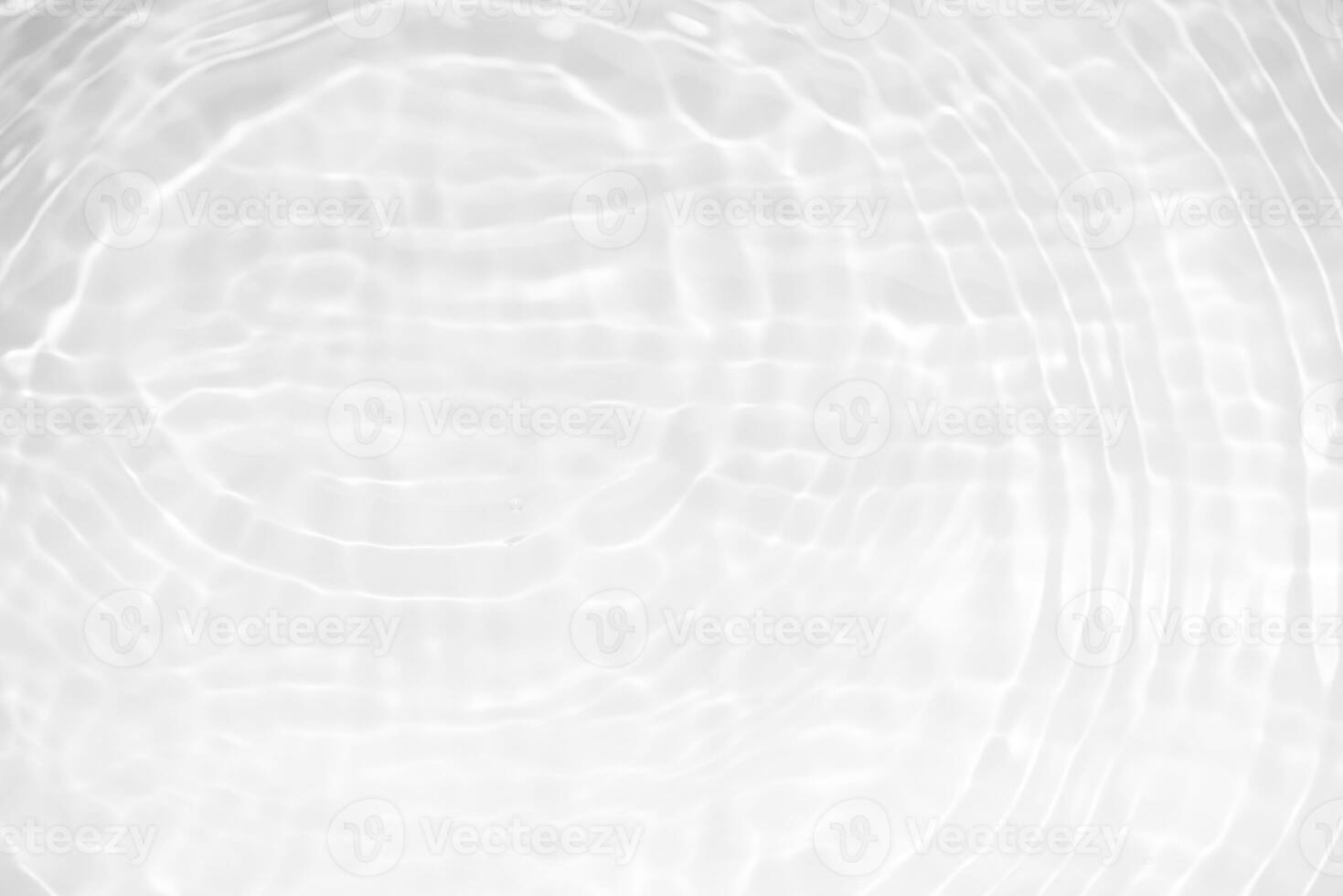 White water with ripples on the surface. Defocus blurred transparent white colored clear calm water surface texture with splashes and bubbles. Water waves with shining pattern texture background. photo