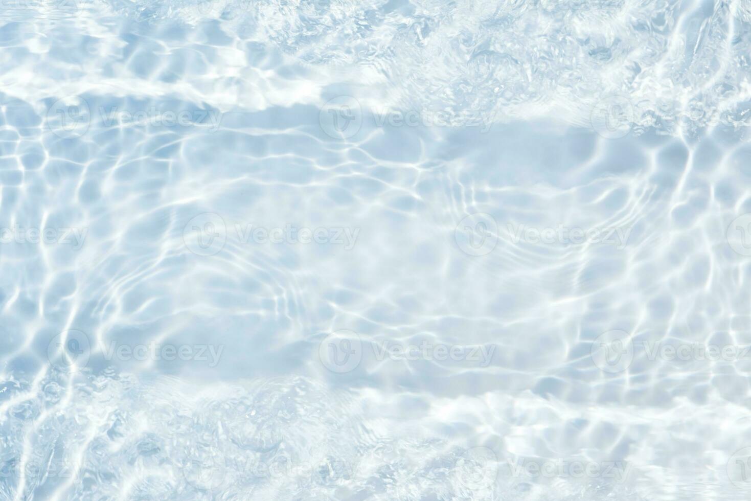 White water with ripples on the surface. Defocus blurred transparent white colored clear calm water surface texture with splashes and bubbles. Water waves with shining pattern texture background. photo