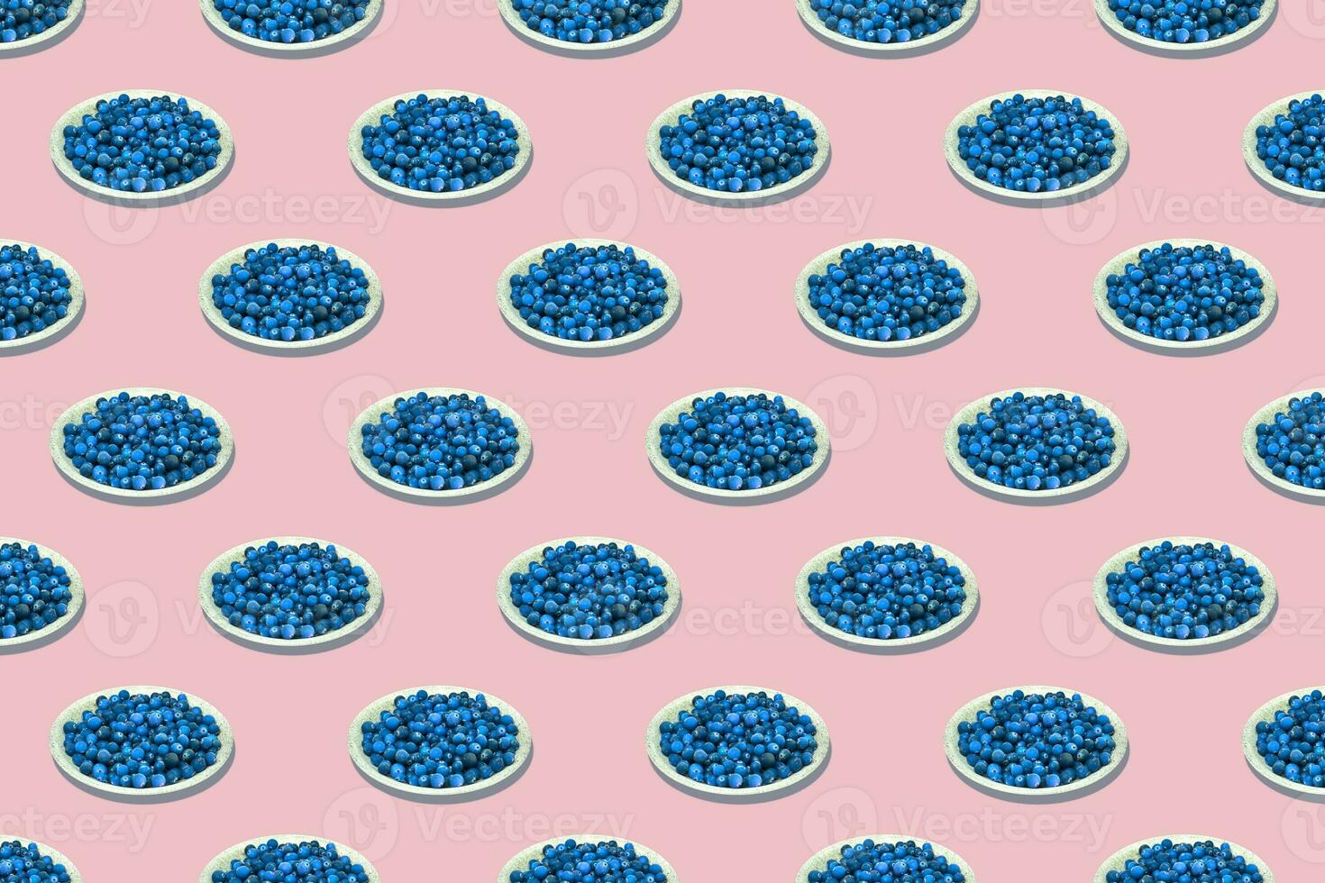 Seamless pattern plates with blueberries isolated on pink background. photo