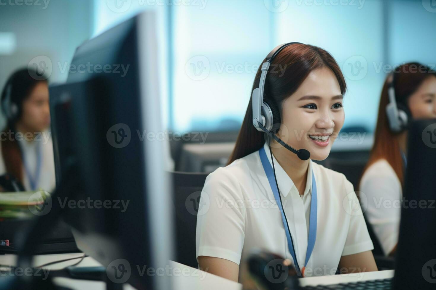 an asian people wearing a headset working in a call center photo