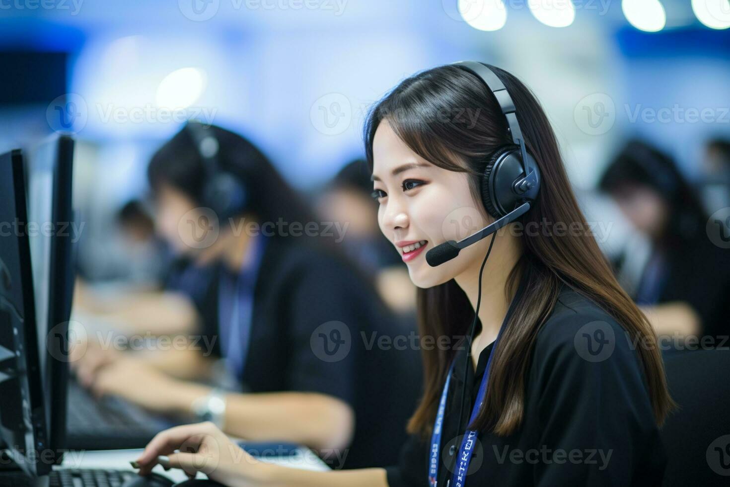 an asian people wearing a headset working in a call center photo