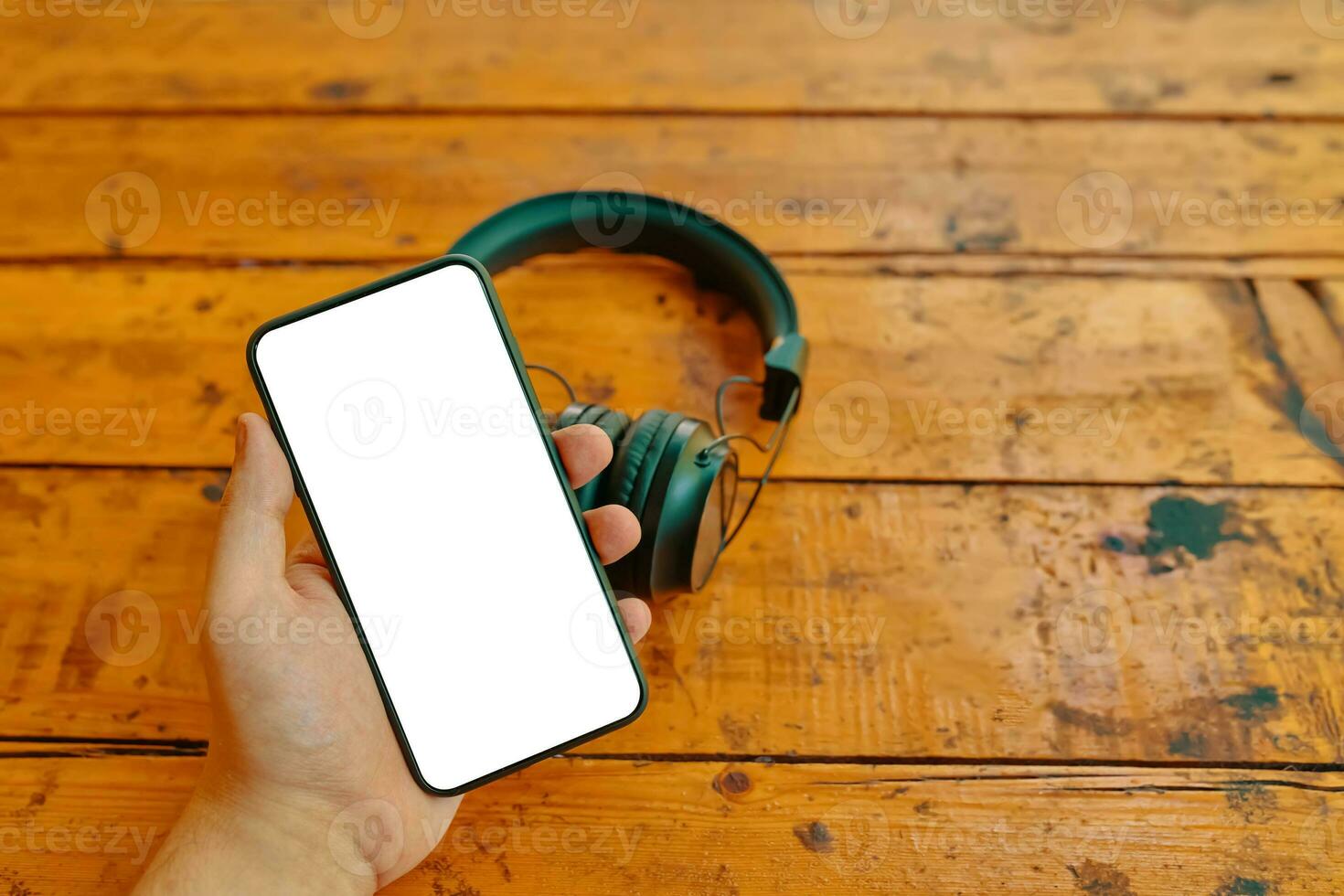 Mobile phone and wireless headphones. photo