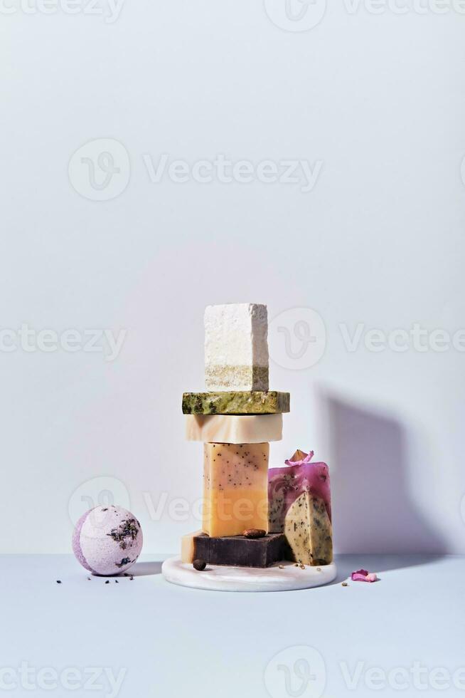 Natural soap bars and salt bomb with ingredients. Diy cosmetics products. Spa bath still life, front view photo