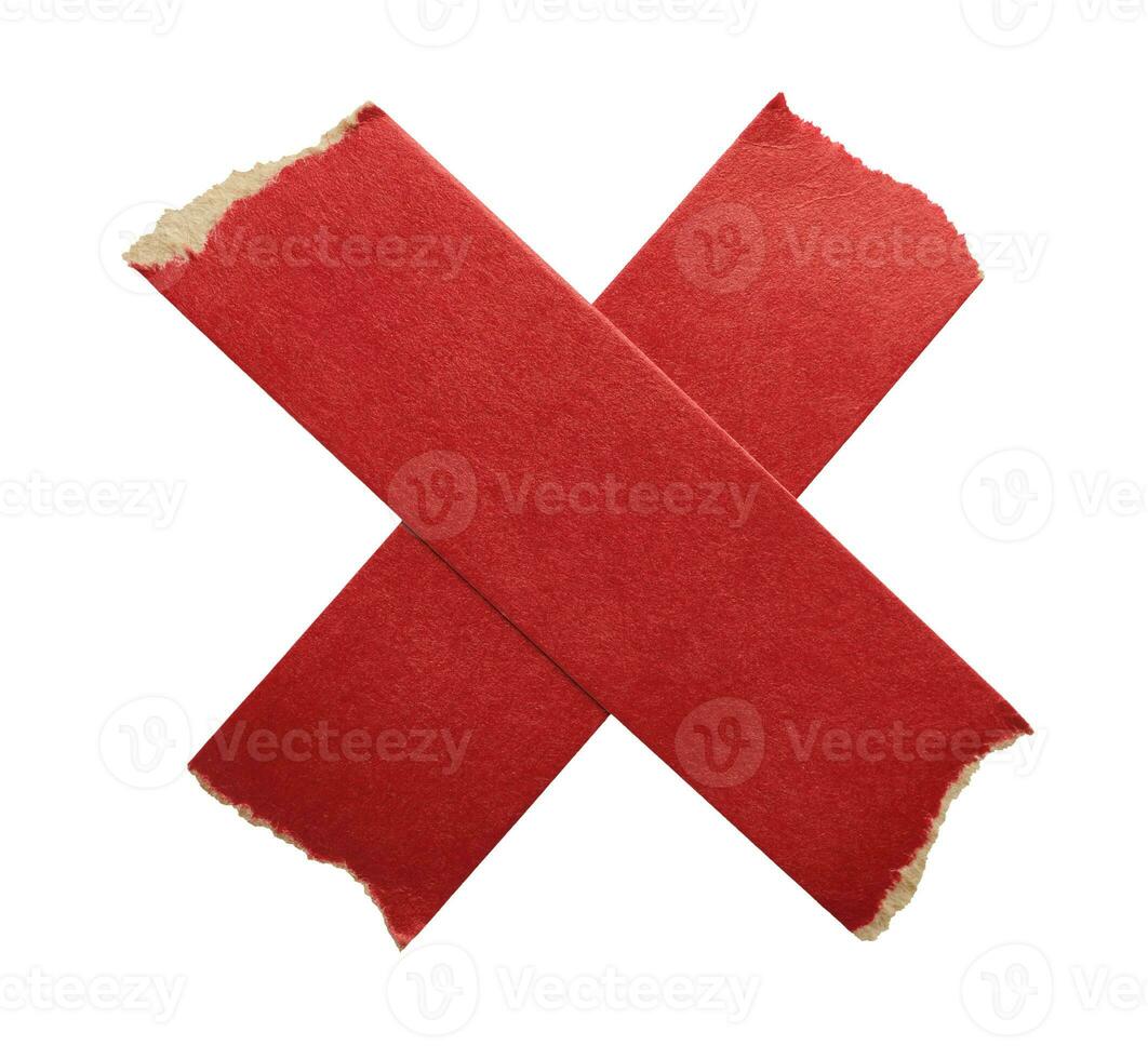 Adhesive red paper X shaped tape cut out on white background photo