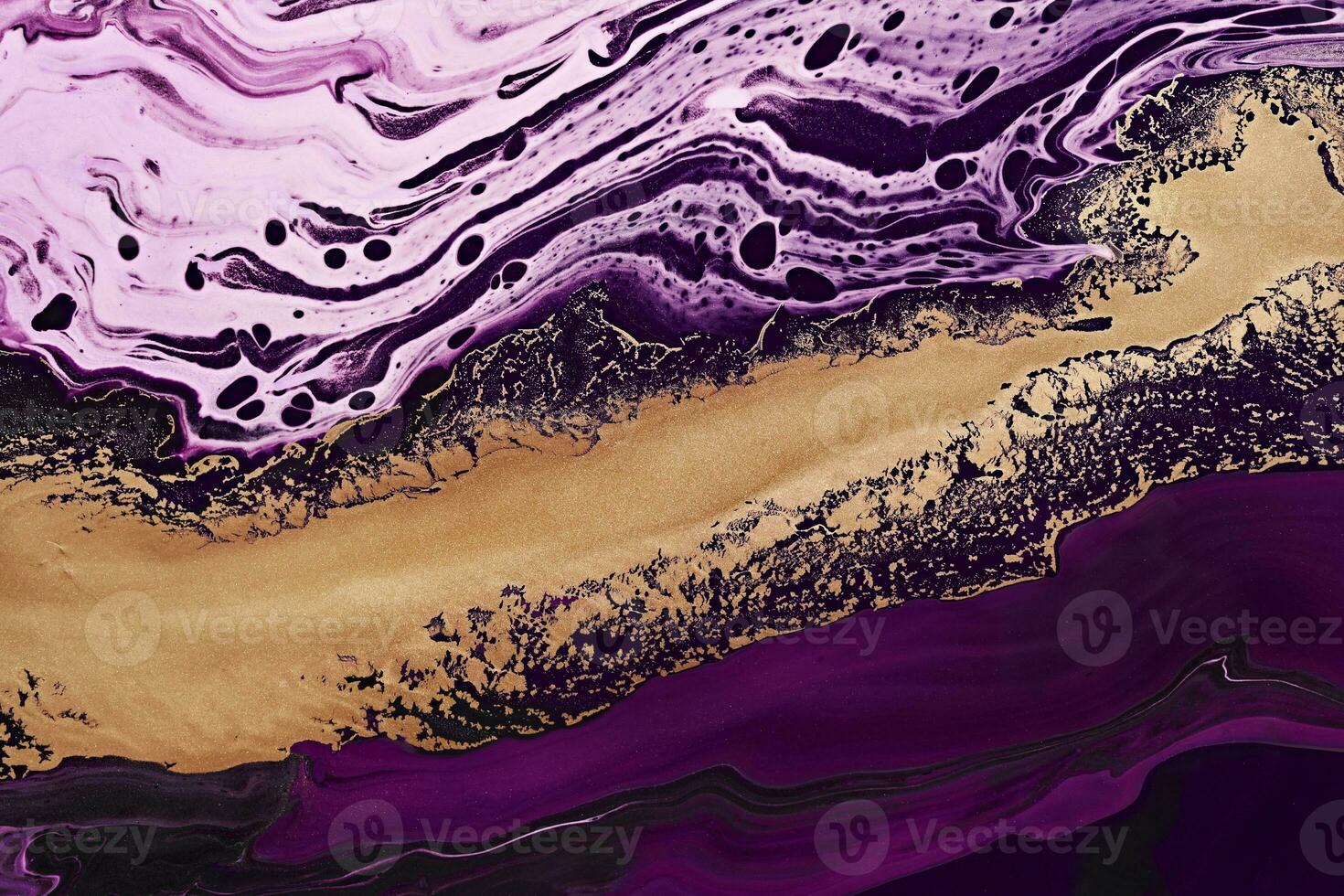 Fluid Art. Metallic gold abstraction and purple waves. Marble effect background or texture photo