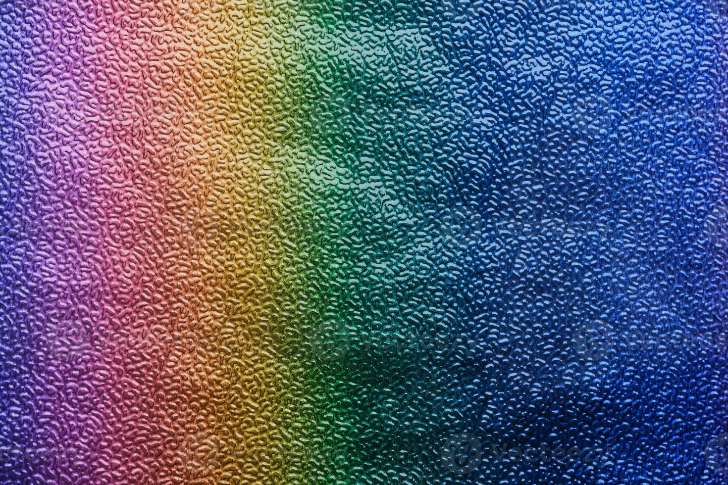 Rainbow gradient textural Background. Textured metallic paper or foil photo