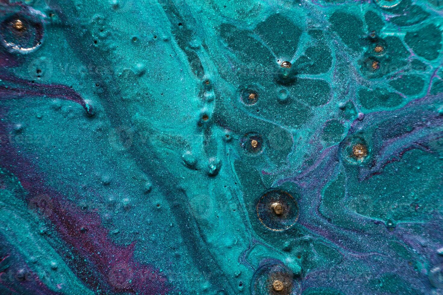 Fluid Art. Embossed mixing, craters and drips of turquoise paint. Marble effect background or texture photo