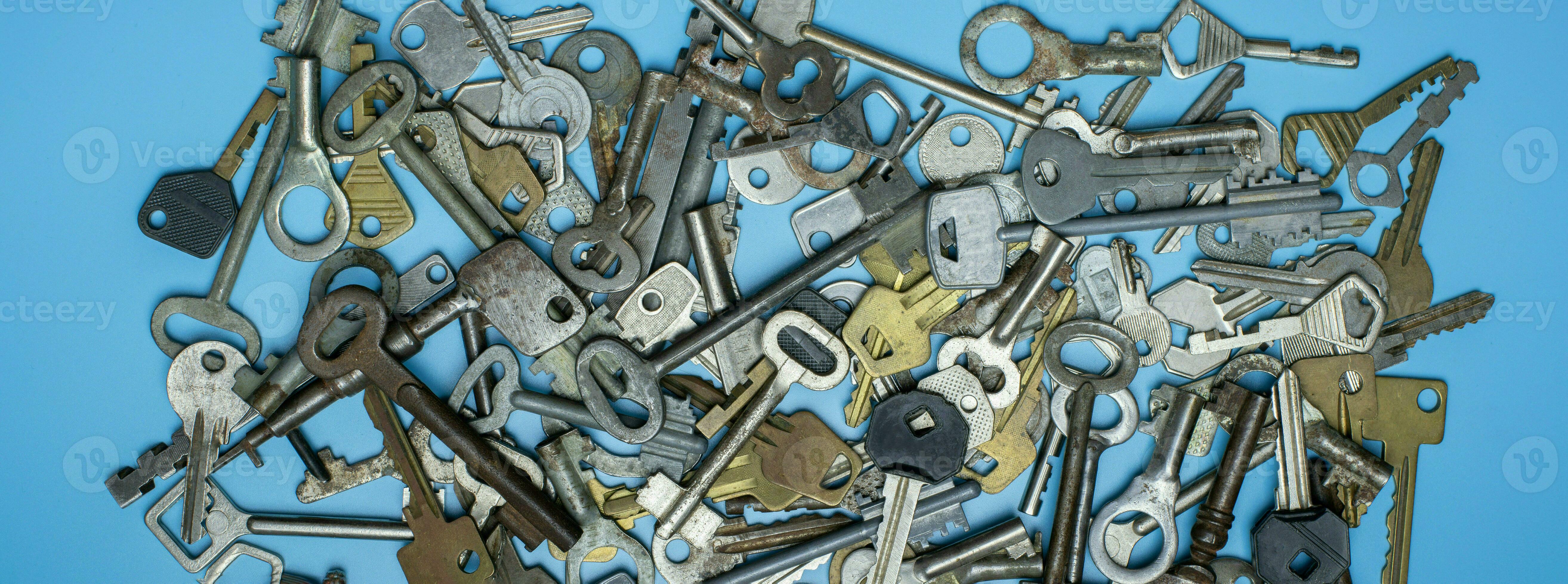 Keys set on blue background. Door lock keys and safes for property security and house protection