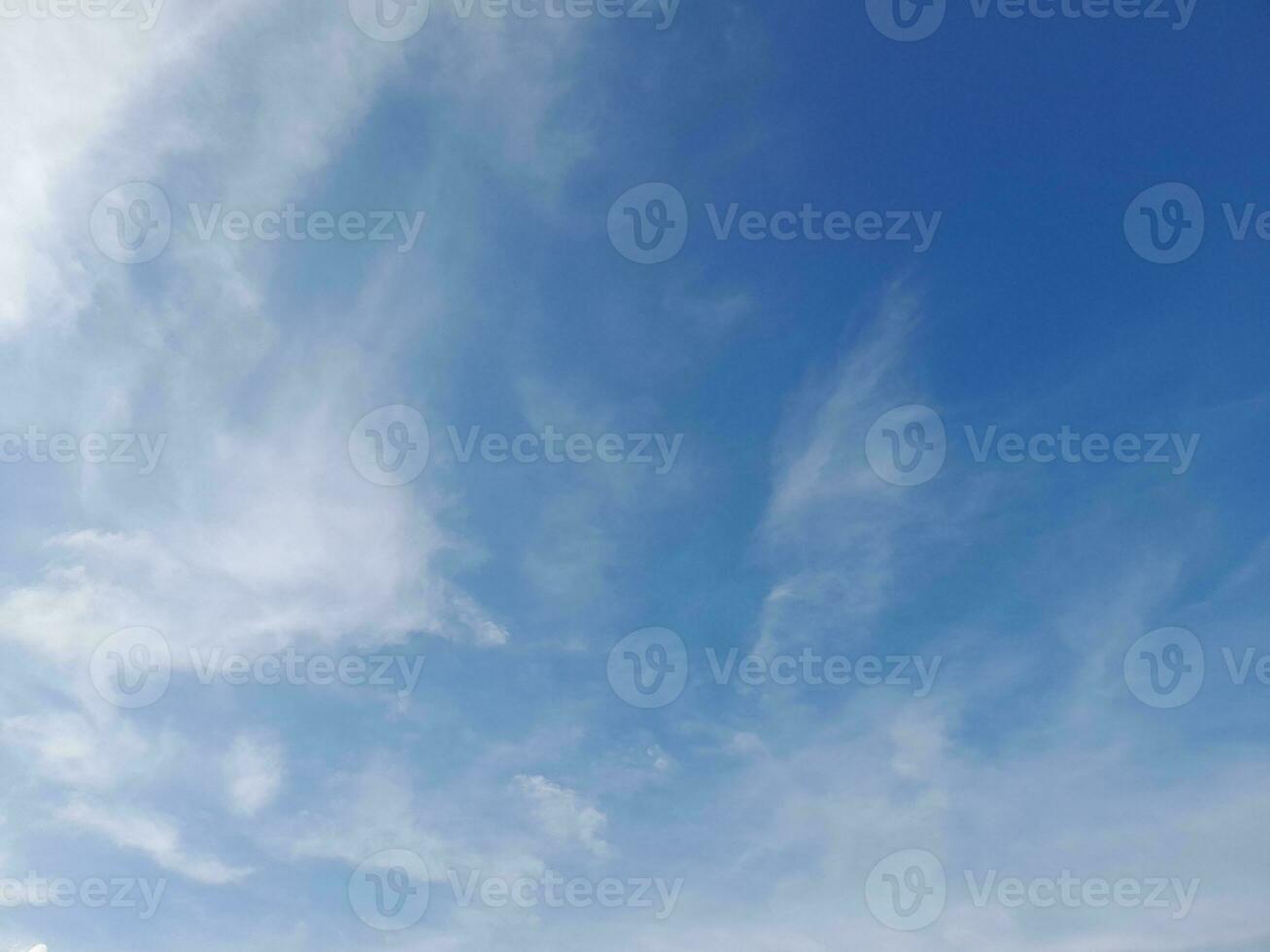 Beautiful white clouds on deep blue sky background. Large bright soft fluffy clouds are cover the entire blue sky. Skyscape on Lombok Island, Indonesia photo