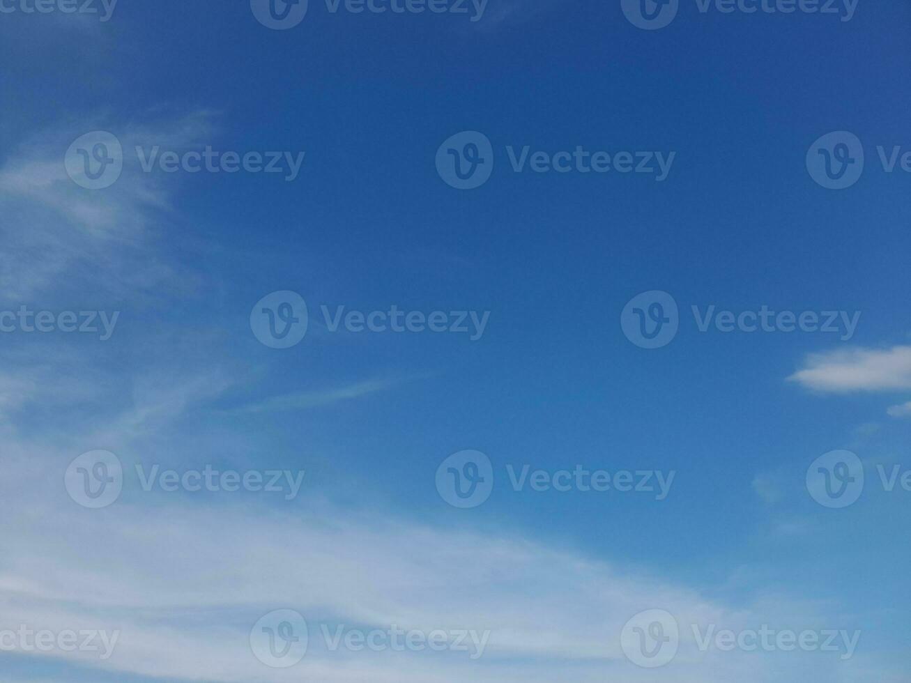 Beautiful white clouds on deep blue sky background. Large bright soft fluffy clouds are cover the entire blue sky. Skyscape on Lombok Island, Indonesia photo