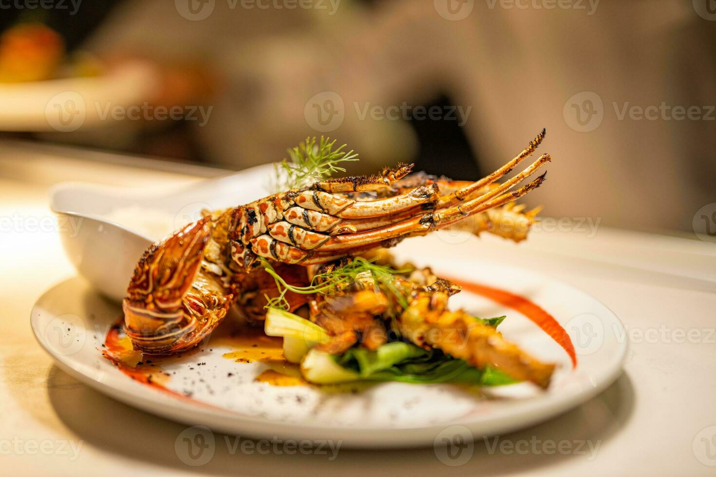 Delicious, hot and cheesy freshly baked Lobster. Juicy and tasty bright red Maine Lobster or American lobster. Sweet and flavorful lobster. Luxury seafood plate before serving, gourmet cuisine dinner photo