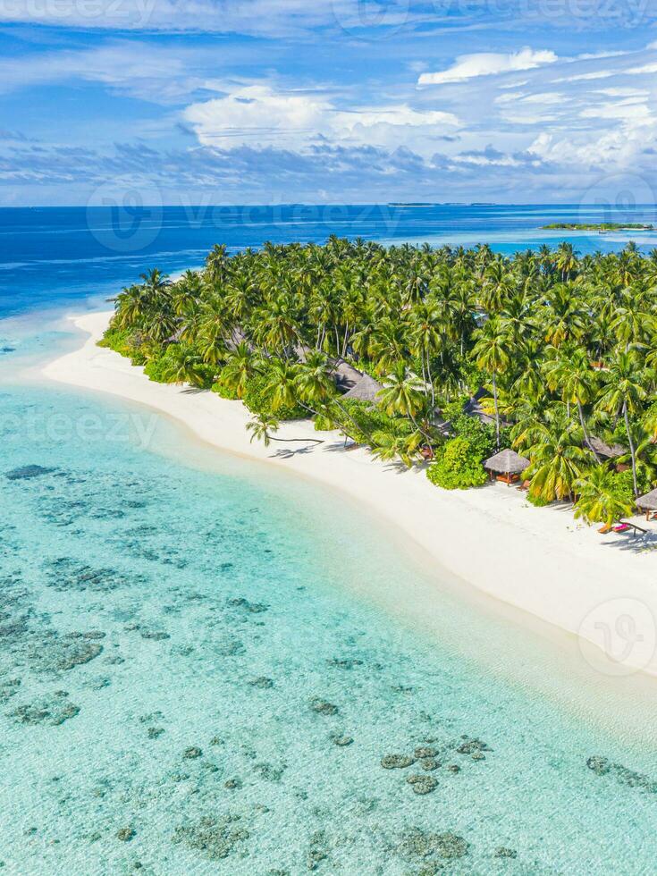 Sea beach aerial. Luxury summer travel vacation landscape. Tropical beach, drone view. Beach villas bungalows of hotel resort. Perfect beach scene vacation, summer holiday template. Wonderful nature photo