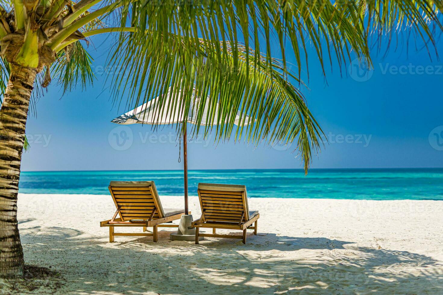 Amazing beach. Romantic chairs umbrella on sandy beach palm leaves, sun sea sky. Summer holiday, couples vacation. Love happy tropical landscape. Tranquil island coast relax beautiful landscape design photo