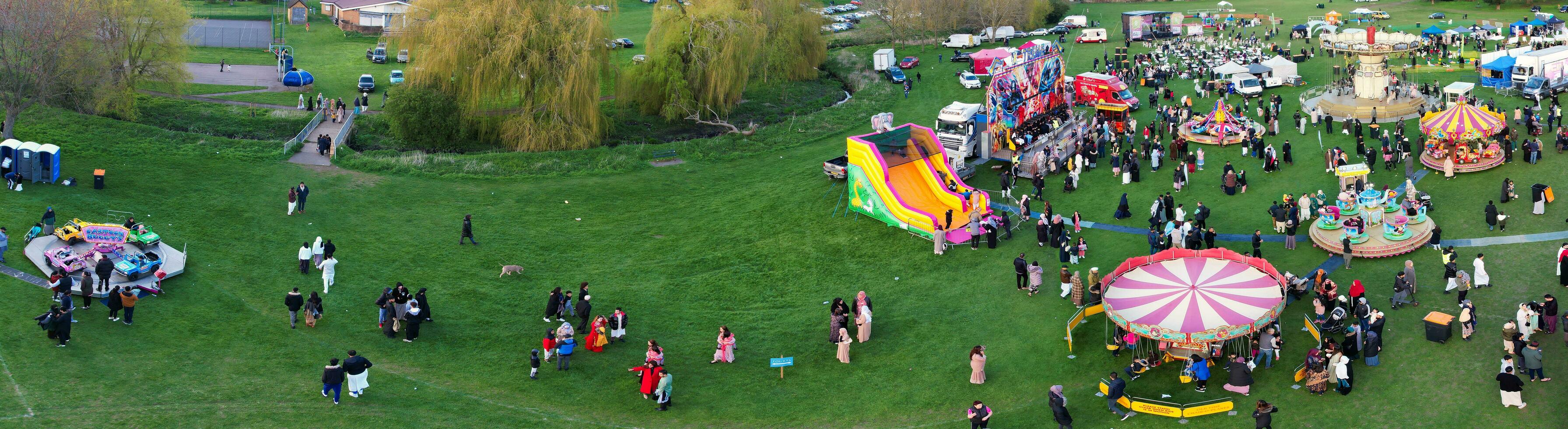 High Angle Footage of Public Funfair Held at Lewsey Public Park of Luton with Free Access for Muslim Community on Islamic Holy Eid Festival Day. April 21st, 2023 photo