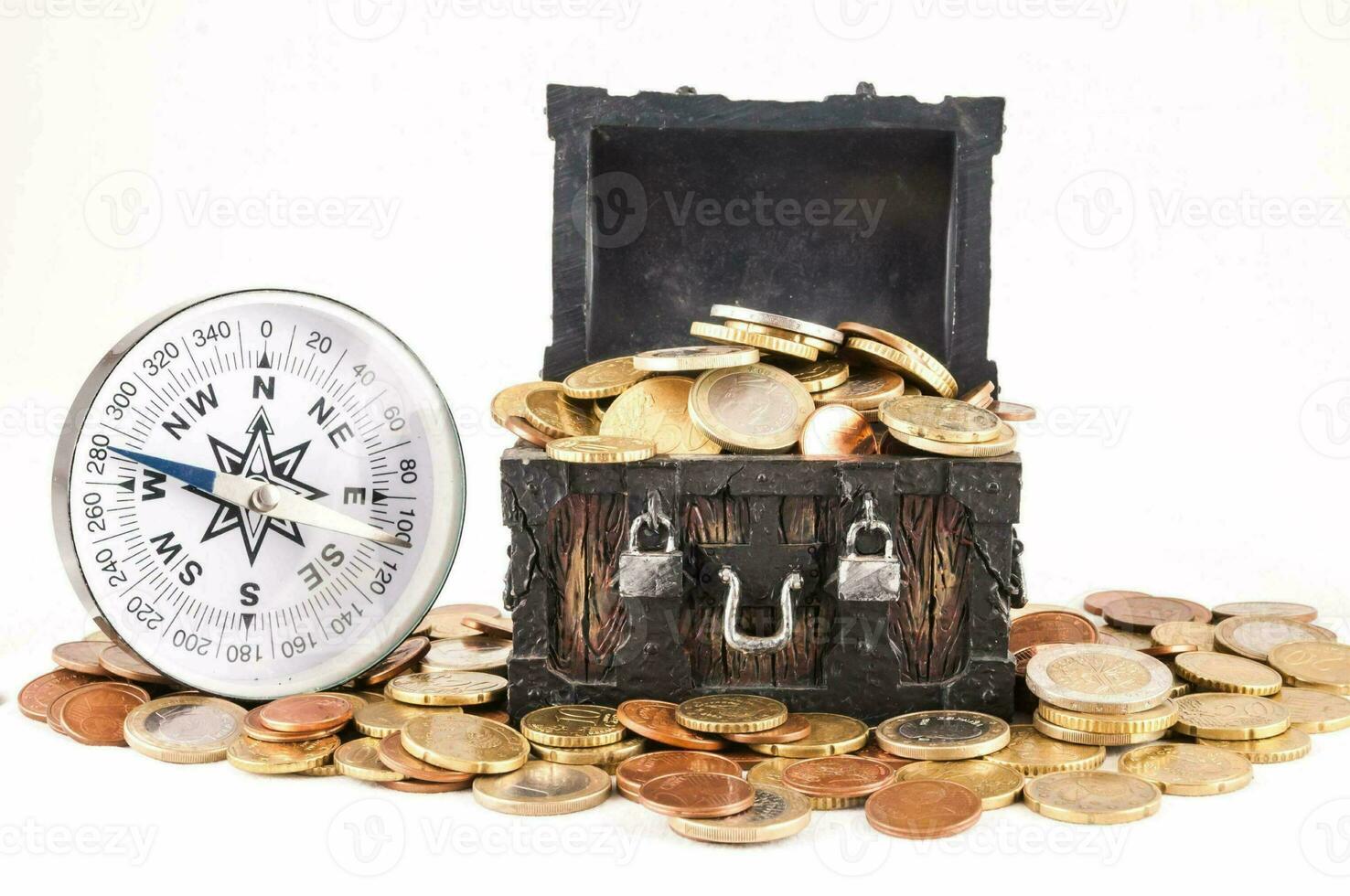 a chest with coins and a compass photo