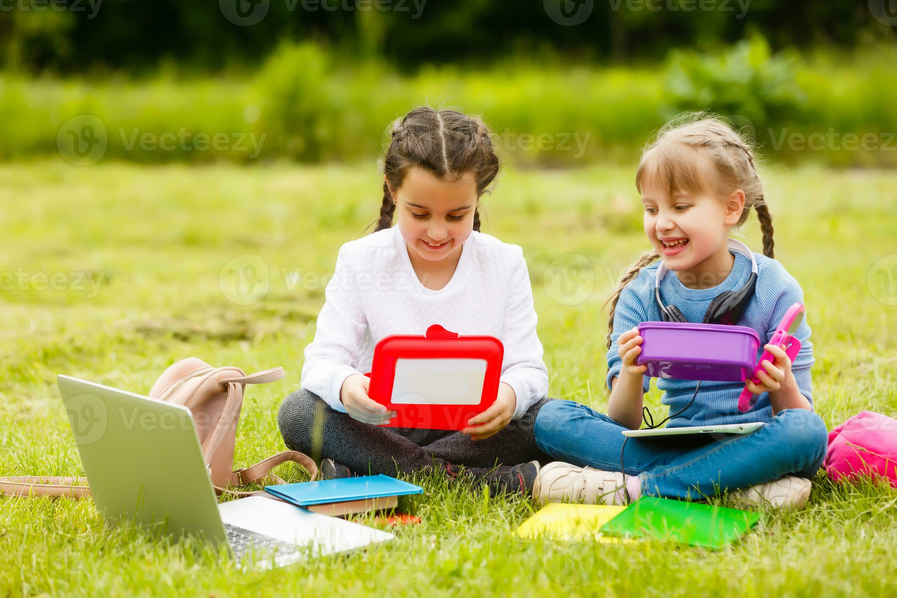 Kids On The Picnic In School Grass Yard Are Coming Eat Lunch In Box kids-on-the-picnic-in-school-grass-yard-are-coming-eat-lunch-in-box