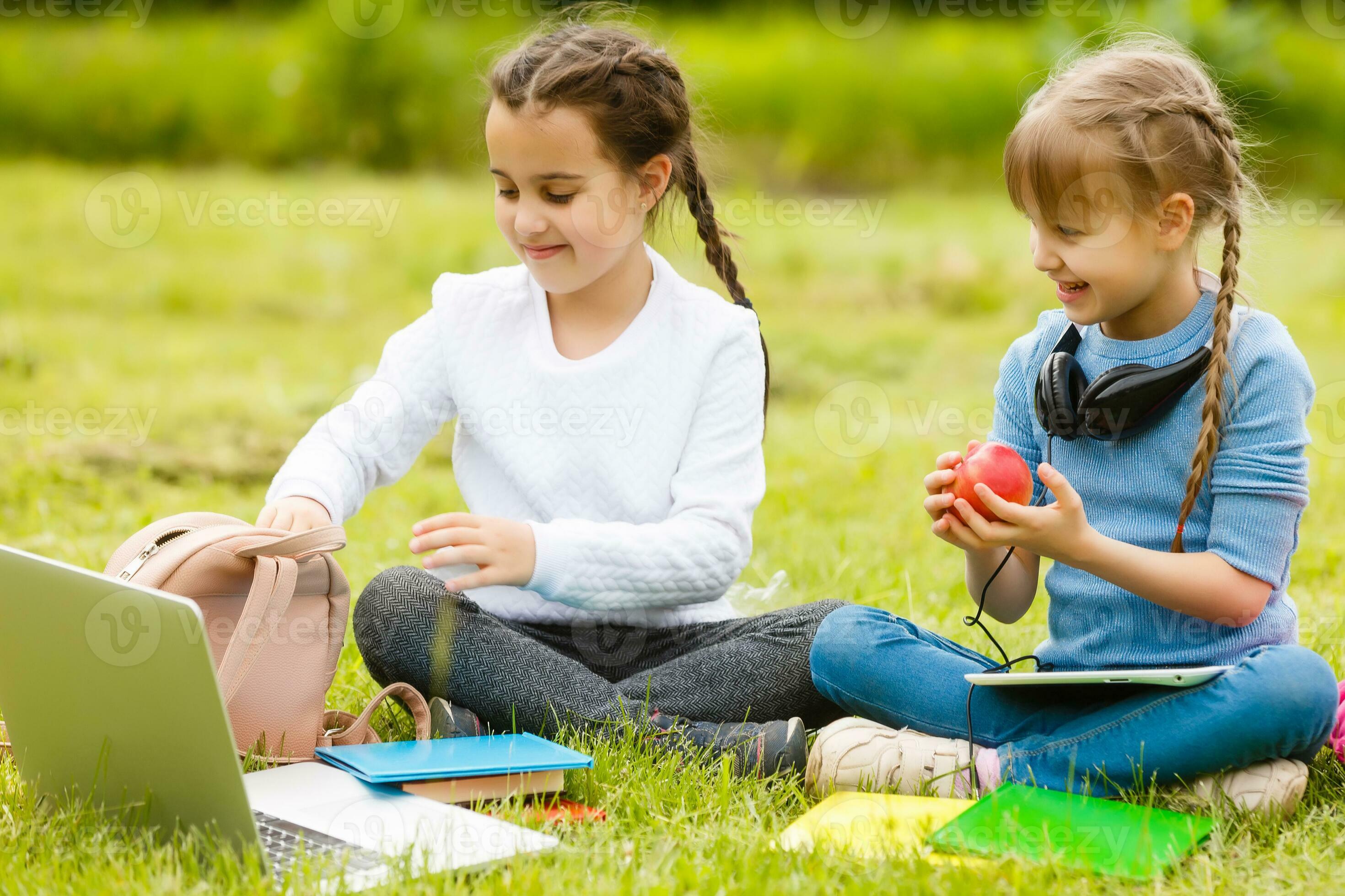 Kids On The Picnic In School Grass Yard Are Coming Eat Lunch In Box kids-on-the-picnic-in-school-grass-yard-are-coming-eat-lunch-in-box