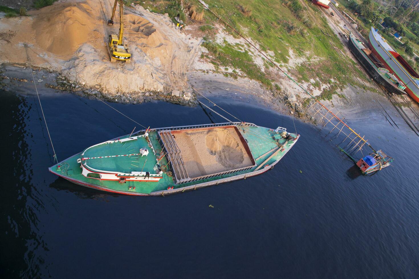 Top view of Sand bulkheads ships Waiting for unloaded in Sitalakhya River, Narayanganj, Bangladesh photo