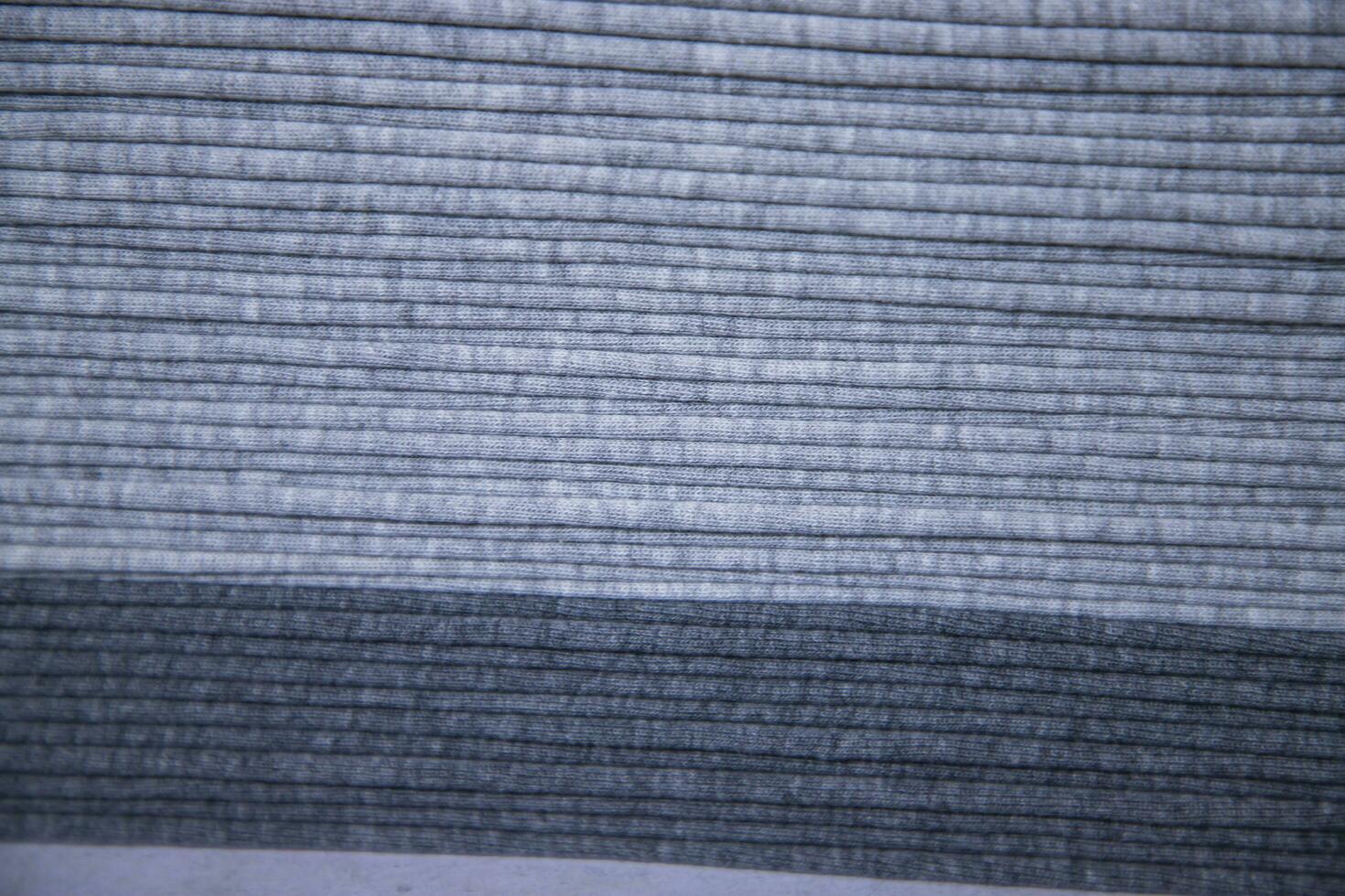 Stacked folded  Gray fabric Surface Texture Background Wallpaper photo