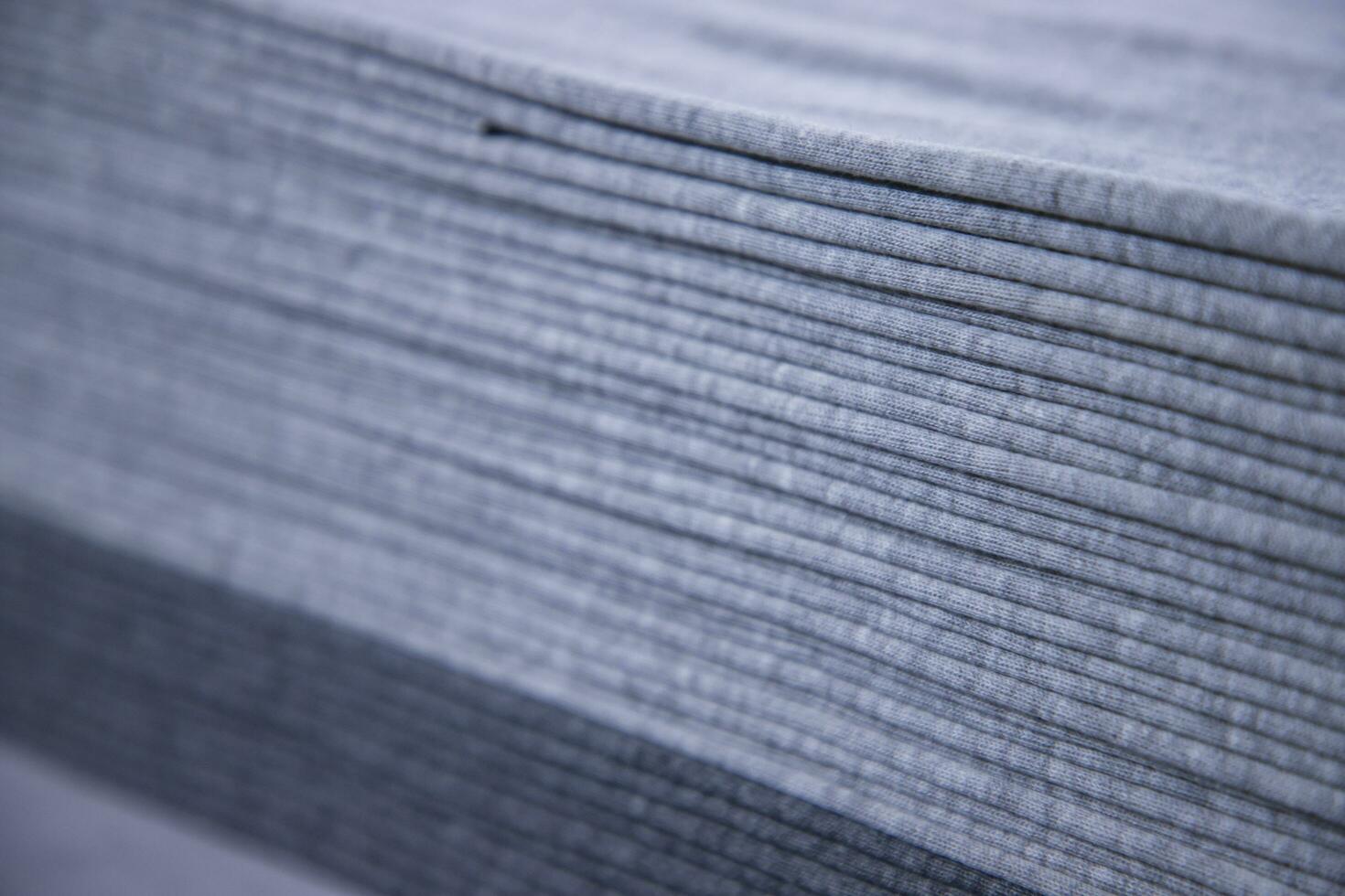 Stacked folded  Gray fabric Surface Texture Background Wallpaper. Selective Focus photo