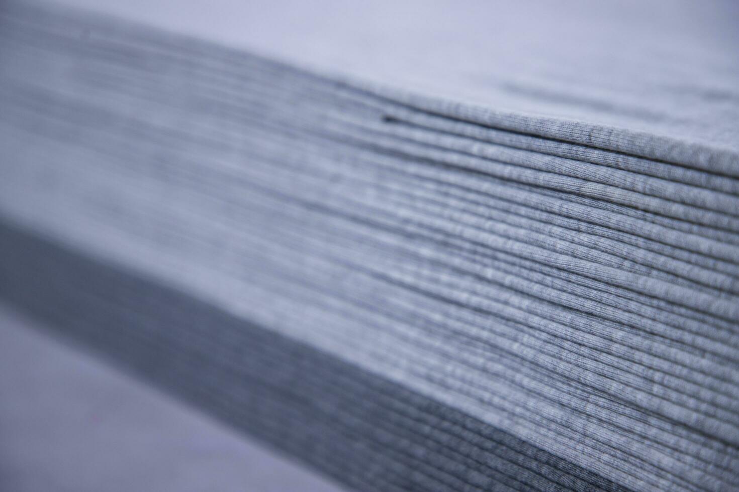 Stacked folded  Gray fabric Surface Texture Background Wallpaper. Selective Focus photo