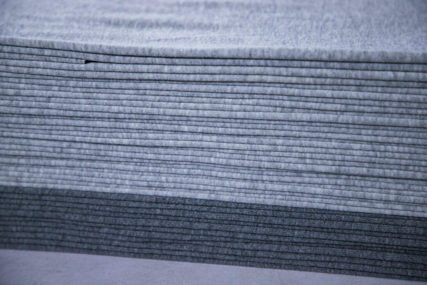 Stacked folded  Gray fabric Surface Texture Background Wallpaper photo