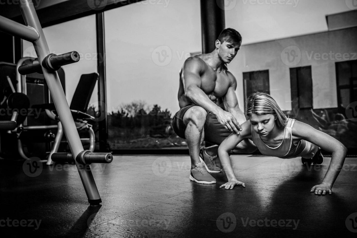 Sportive woman doing plank exercise training back and press musc photo