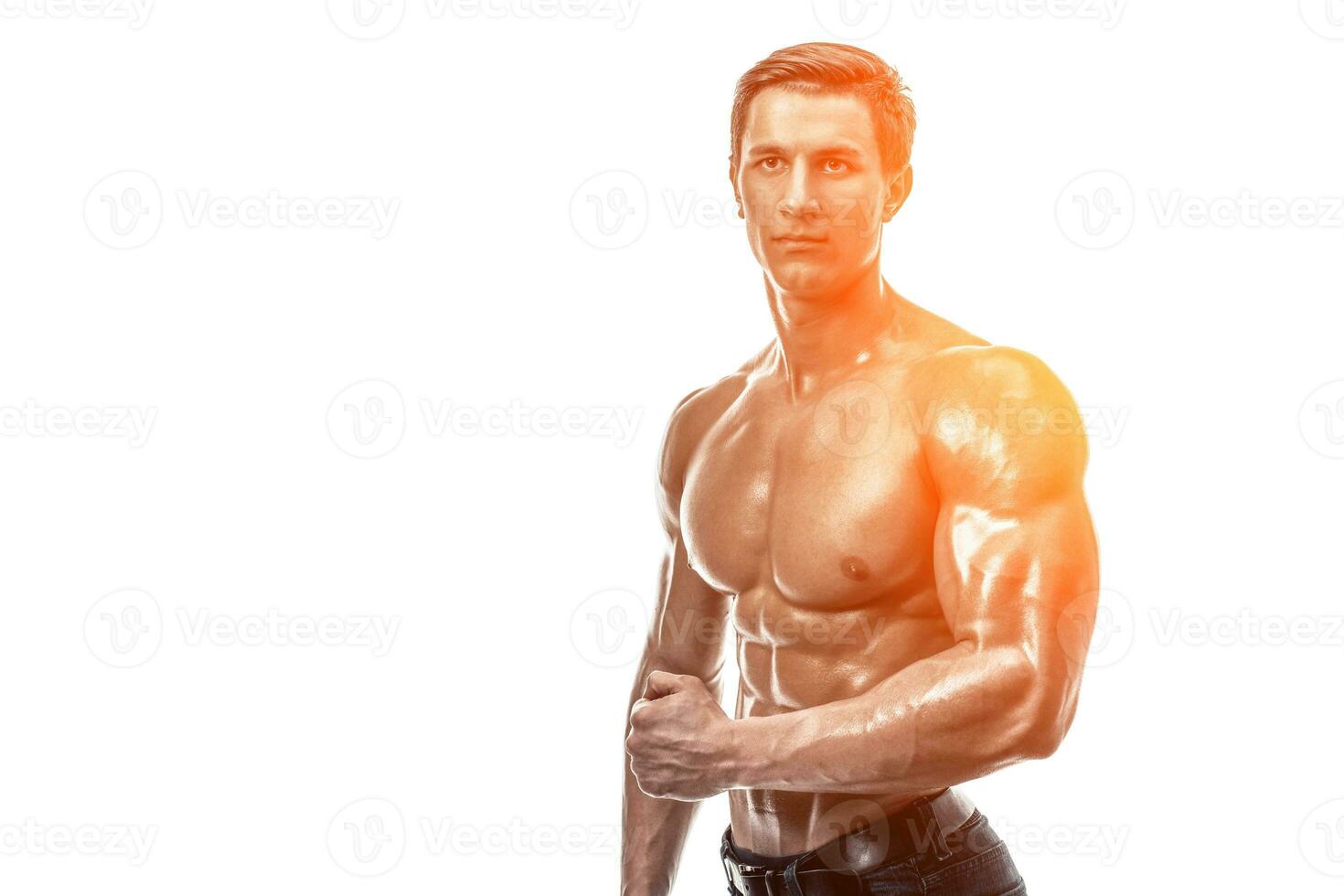 Muscular handsome young man with naked torso. Isolated on white photo