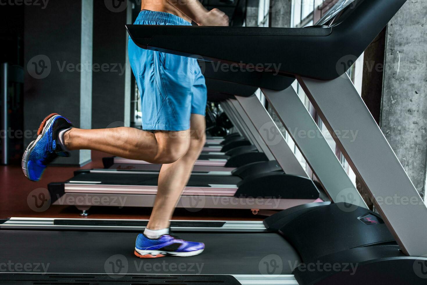 Legs running on the treadmill close up photo