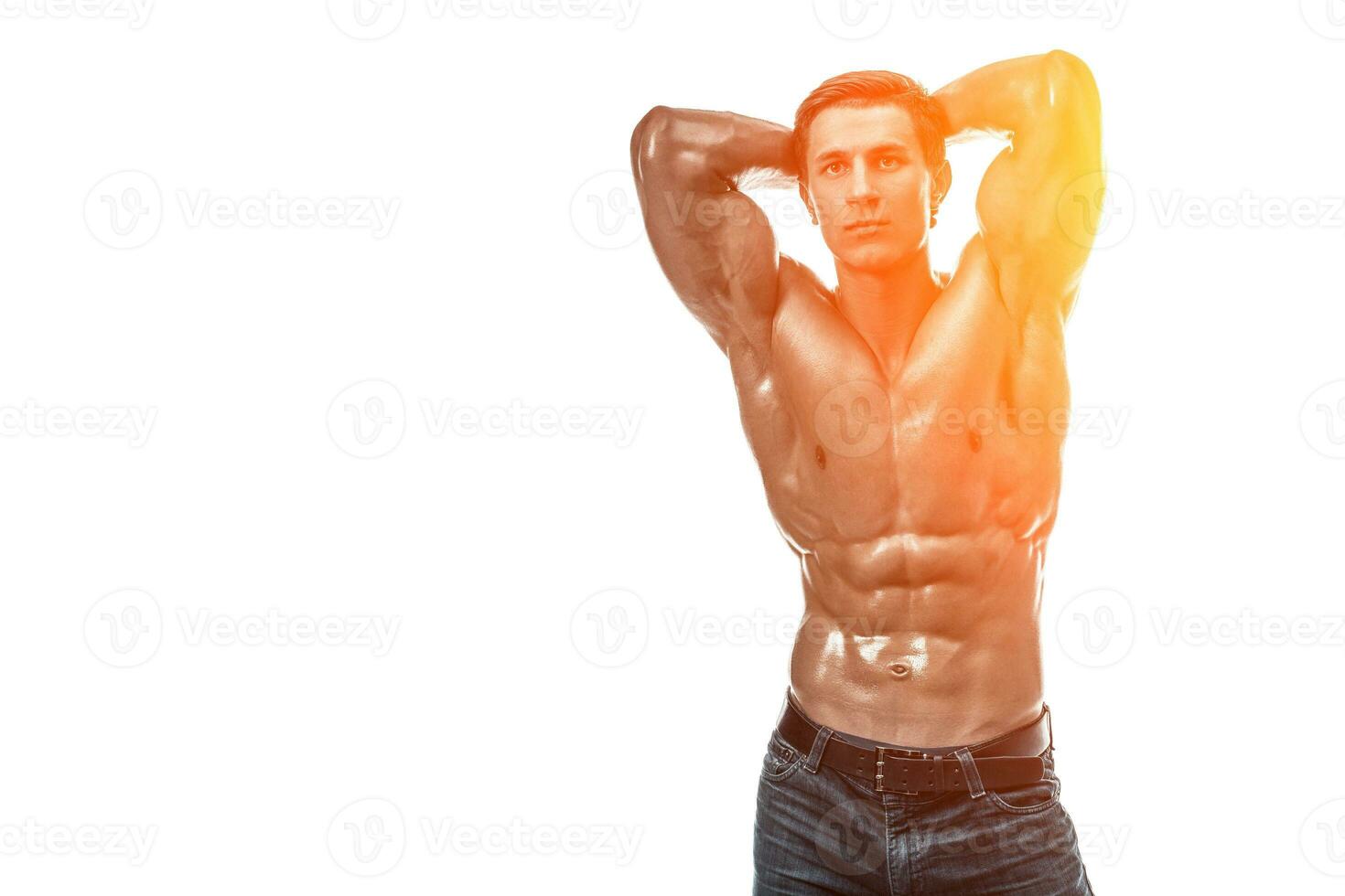 Muscular handsome young man with naked torso. Isolated on white photo