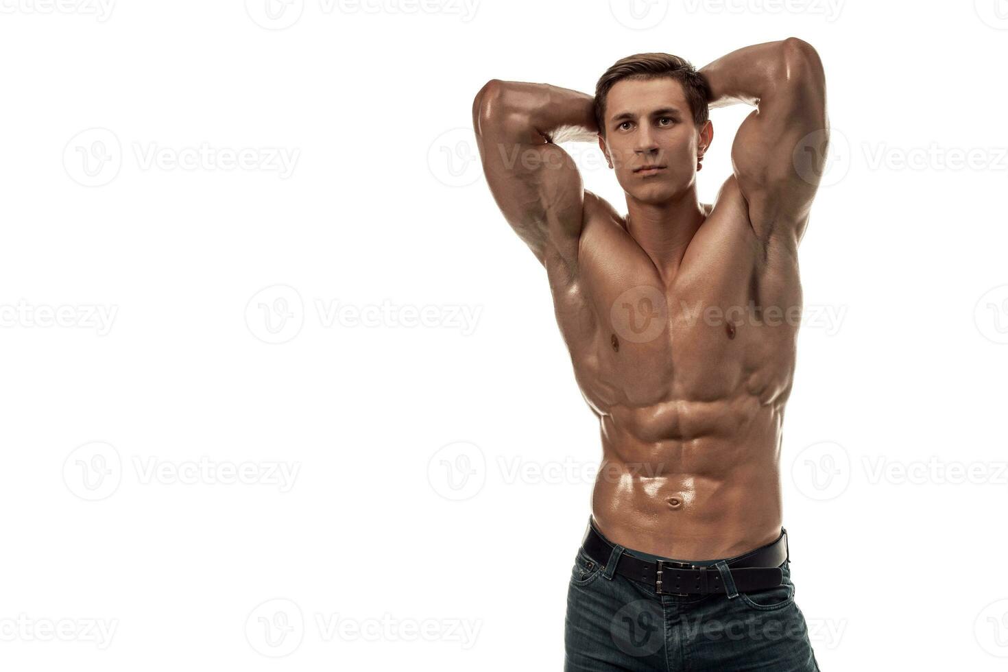 Muscular handsome young man with naked torso. Isolated on white background. Copy space photo