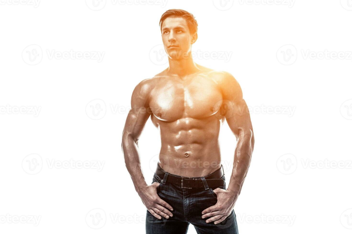 Muscular handsome young man with naked torso. Isolated on white photo