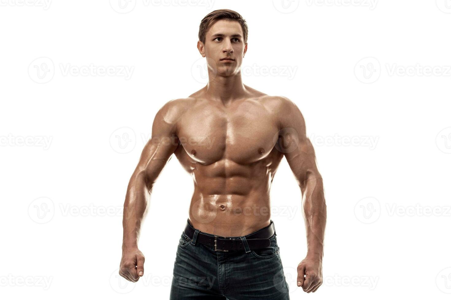 Muscular handsome young man with naked torso. Isolated on white background. Copy space photo