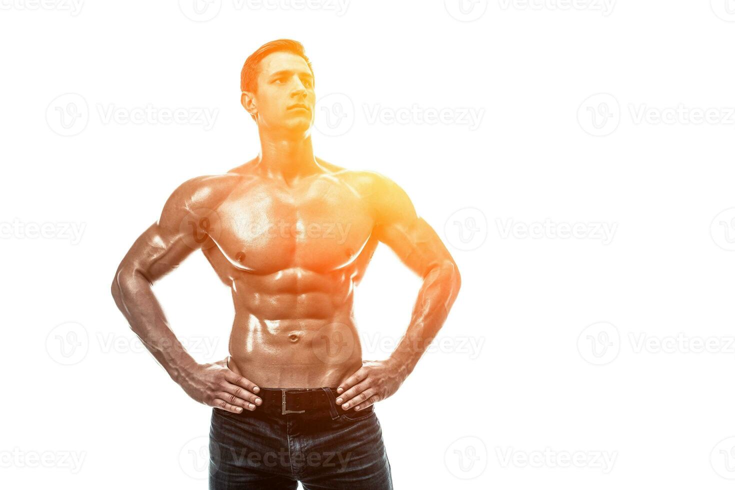 Muscular handsome young man with naked torso. Isolated on white photo