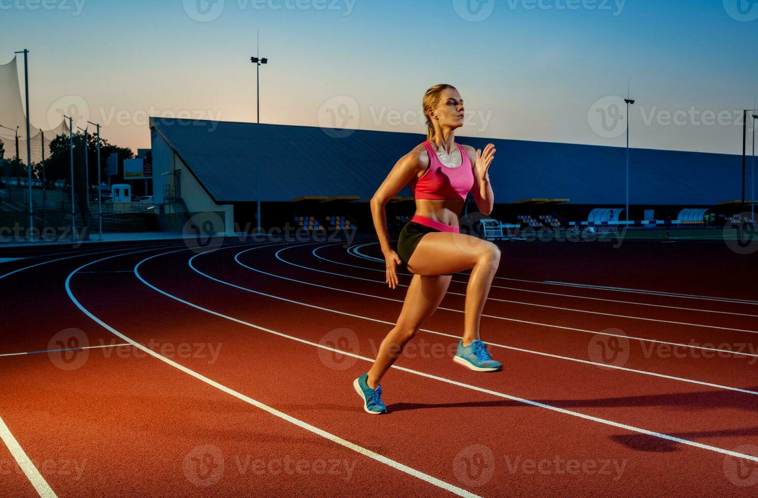 Runner sprinting towards success on run path running athletic track. Goal achievement concept. photo