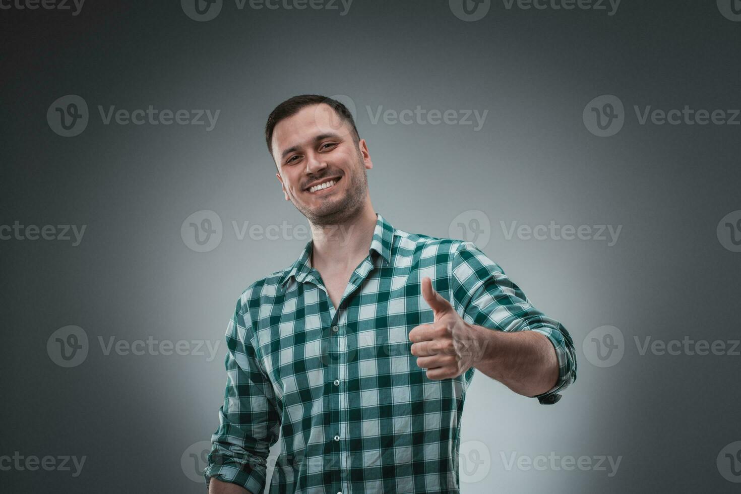 Portrait of man on gray background. Man showing different emotions. photo