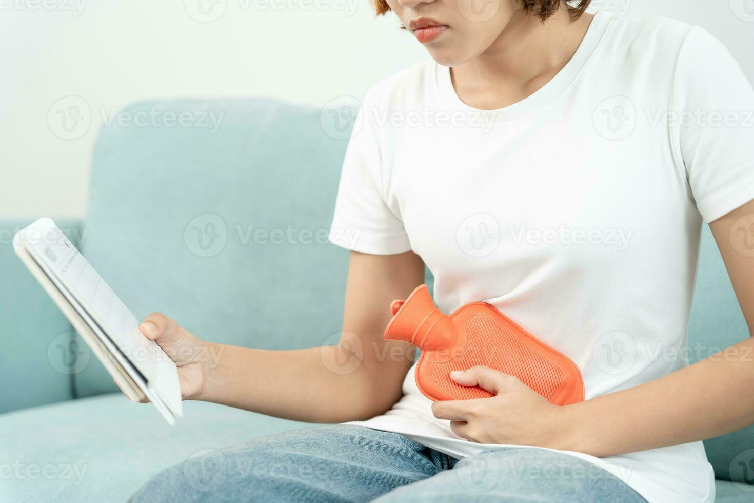 stomach ache. Asian women have abdominal pain, indigestion, gastritis, menstrual cramps, flatulence, diarrhea, distention, colon cancer, belly inflammation problem, suffer food poisoning, abdomen photo