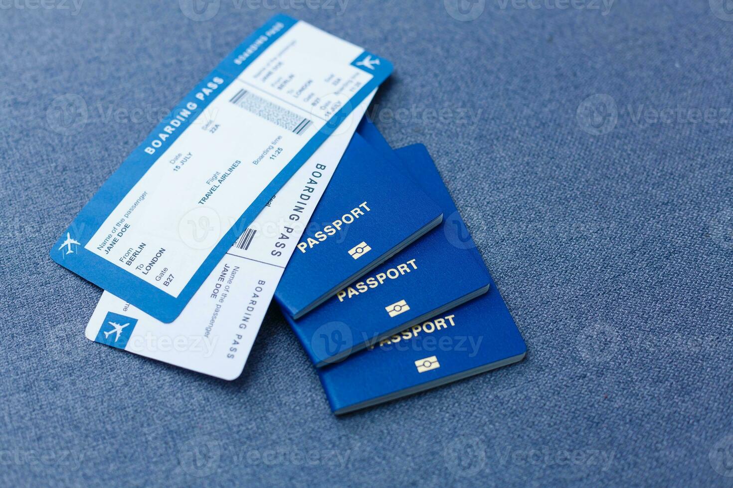 passport with boarding passes on gray background photo
