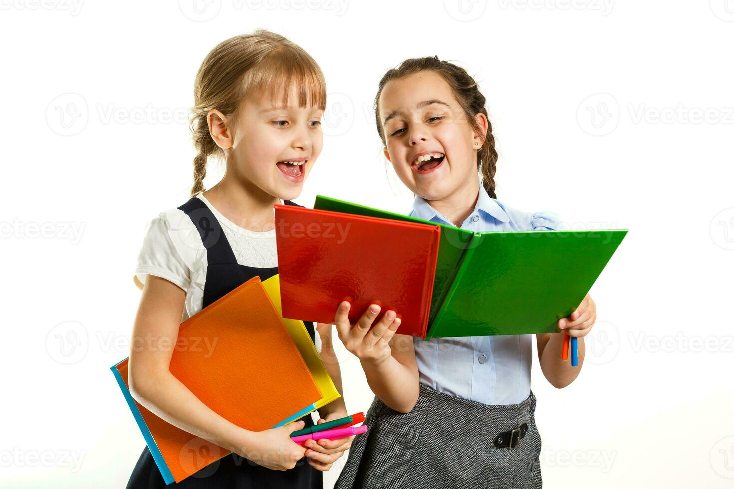 Two little schoolgirls. Education, fashion, friendship concept. photo