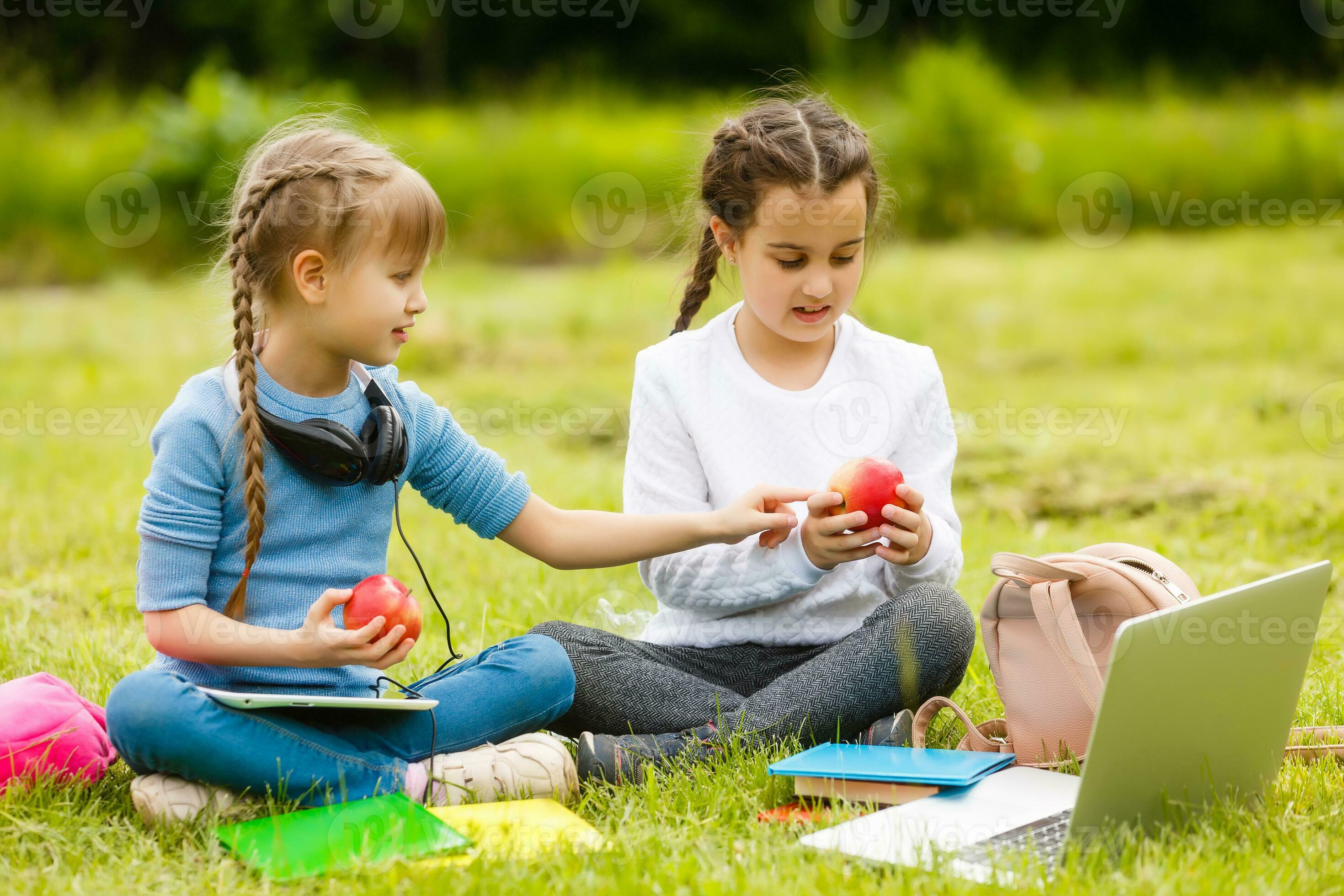 Kids On The Picnic In School Grass Yard Are Coming Eat Lunch In Box kids-on-the-picnic-in-school-grass-yard-are-coming-eat-lunch-in-box