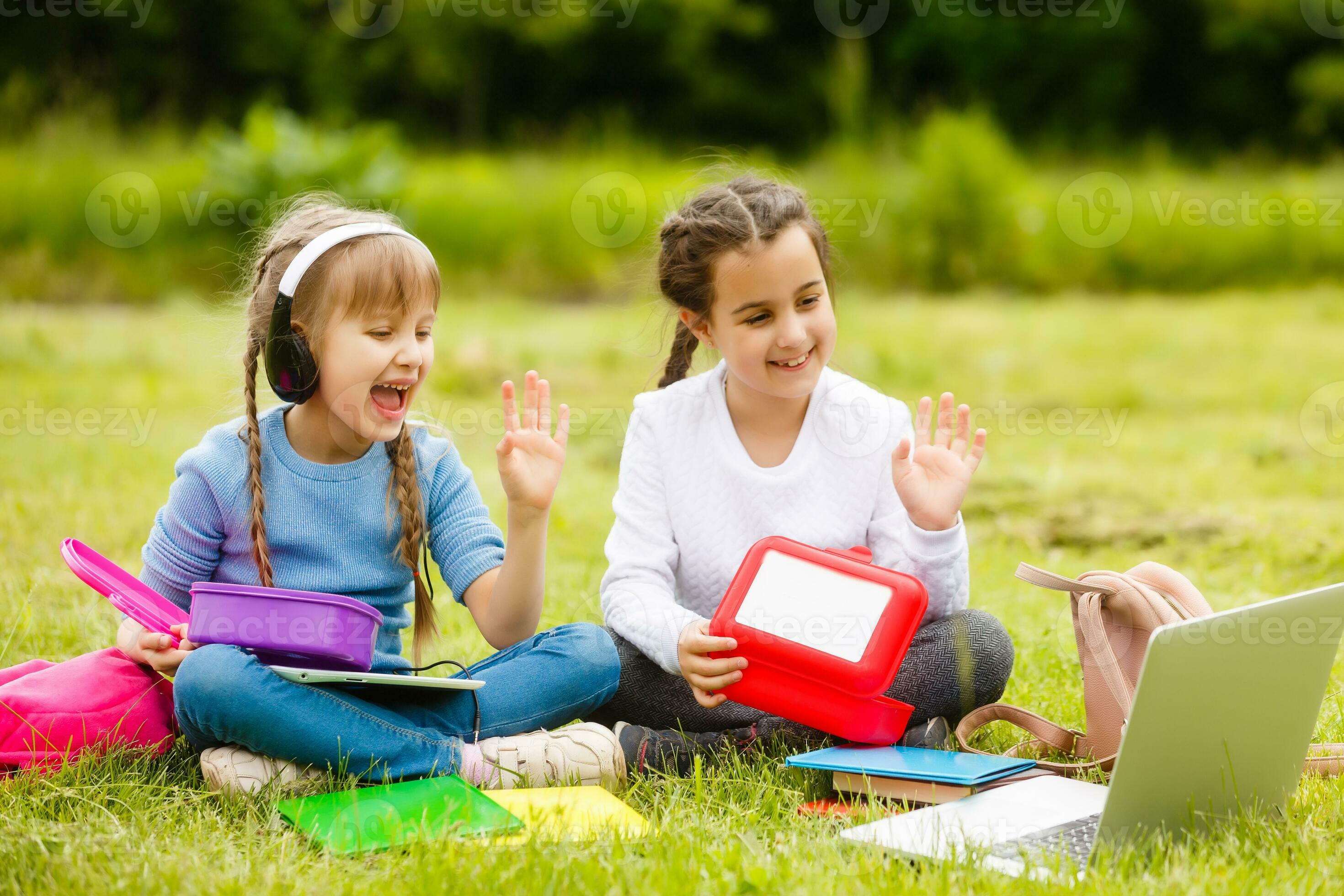 Kids On The Picnic In School Grass Yard Are Coming Eat Lunch In Box kids-on-the-picnic-in-school-grass-yard-are-coming-eat-lunch-in-box